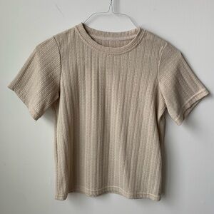 Cream colored short sleeve shirt